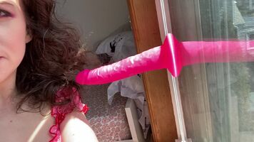 I feel very adorable with my bright pink dildo!