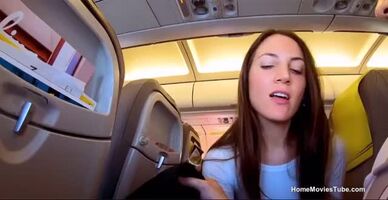 Naughty girl swallows on a crowded plane